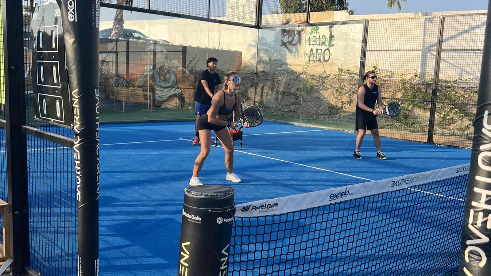 Padel court in Cyprus with players under the sun