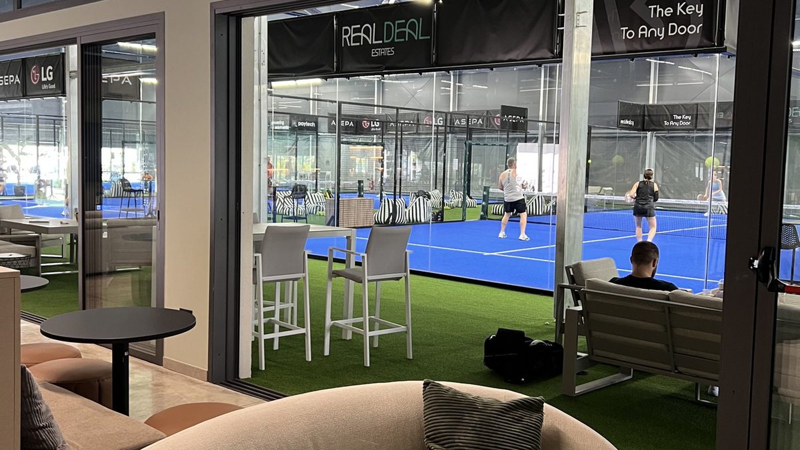 Friends playing padel together